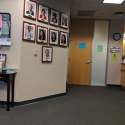 Bass Medical Group - Neurology - Waiting room with doctors' photos on the wall