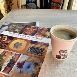 An art book and Americano