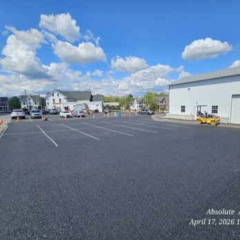Absolute Asphalt & Property Maintenance - Parking lot r&r photo shows 25mm base material to be topped with 9.5mm at a later time. - Snow Removal Near Me Absolute Asphalt & Property Maintenance - Parking lot r&r photo shows 25mm base material to be topped with 9.5mm at a later time. - Snow Removal Near Me