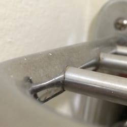 Layer of dust and grime on everything, most visible in picture on the racks in the bathroom.