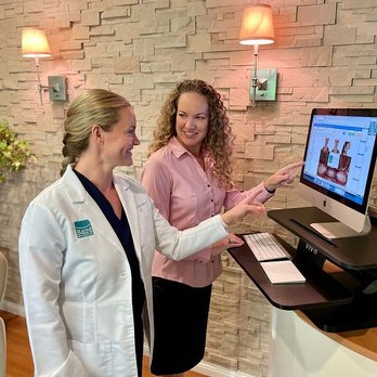 Baird Orthodontics - Dr. Marta Baird meets with Treatment Coordinator, Erin, to review patient photographs before each virtual consult. - Orthodontists Near Me - Pleasanton, California