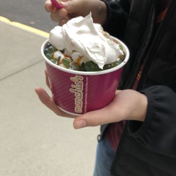 Menchie's Frozen Yogurt - a person holding a cup of ice cream - Desserts Near Me - Spokane, Washington Menchie's Frozen Yogurt - a person holding a cup of ice cream - Desserts Near Me - Spokane, Washington