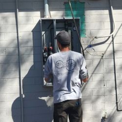 Simple Electric - Technician installing new solar ready panel.