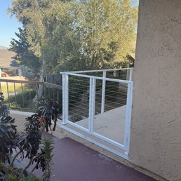 Powder coated steel and cable deck railing with locking 2 door gate and cocktail rail, Color matched house trim. Powder coated steel and cable deck railing with locking 2 door gate and cocktail rail, Color matched house trim.