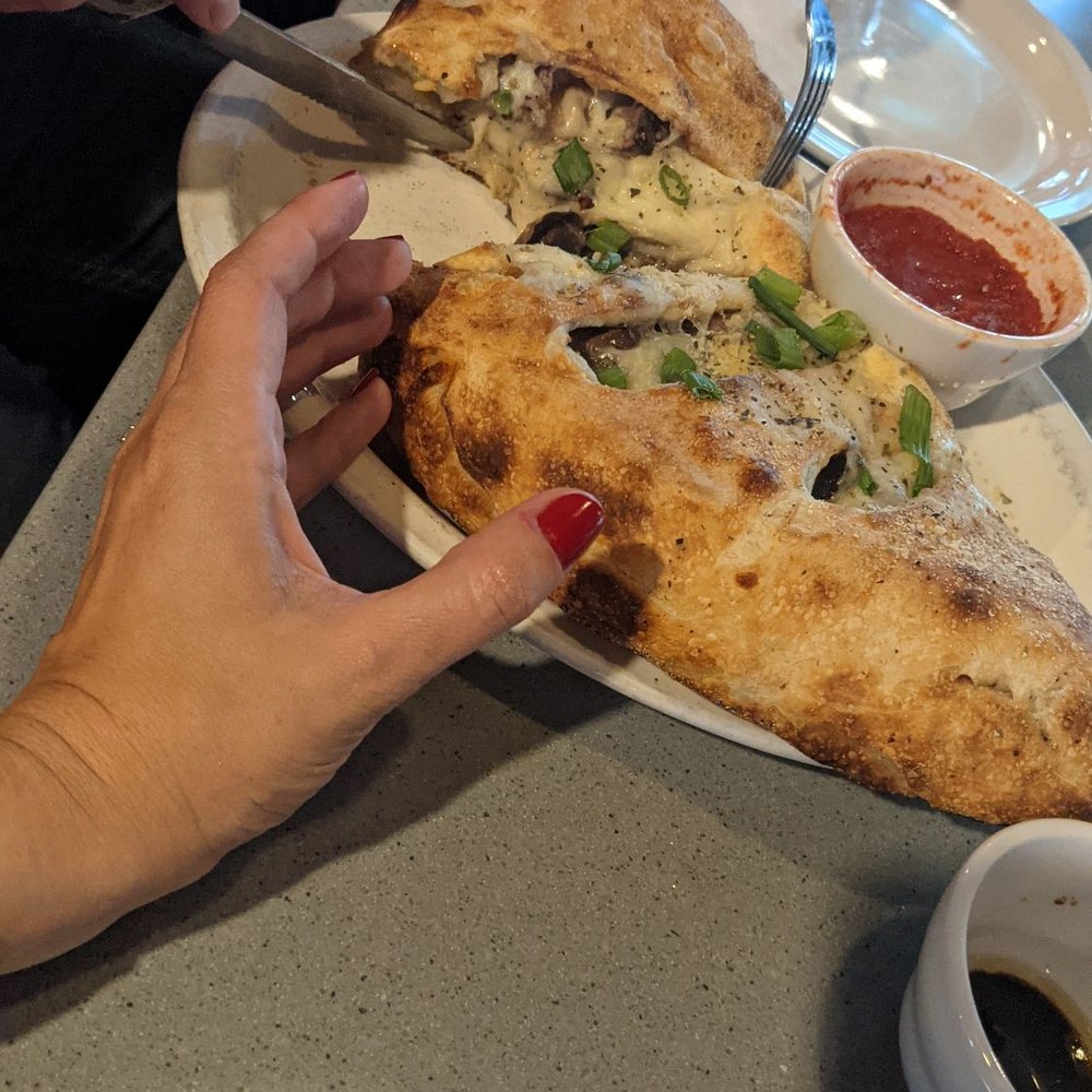 The Yelling Goat - Look at the size of this calzone! - Bars Near Me - Lancaster, New York The Yelling Goat - Look at the size of this calzone! - Bars Near Me - Lancaster, New York