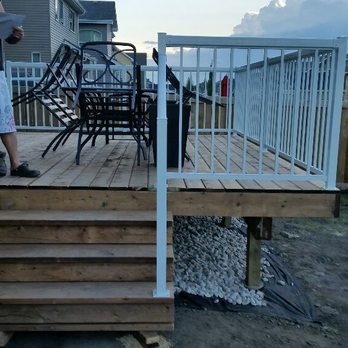 Emerald Contracting - Brown pressure treated lumber with Aluminum Railing - Landscaping Near Me