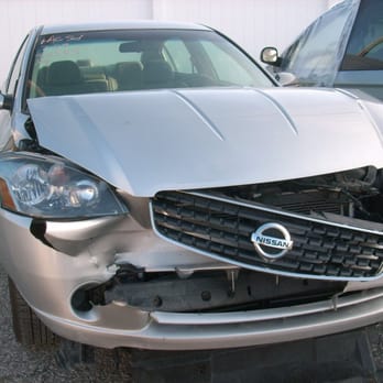 Touch 'N Go Collision Center - This 2005 Nissan Altima was involved in a front in collision. This photo is before repairs have begun. - Body Shops Near Me - Carmel, Indiana Touch 'N Go Collision Center - This 2005 Nissan Altima was involved in a front in collision. This photo is before repairs have begun. - Body Shops Near Me - Carmel, Indiana