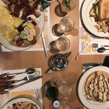 Cora - a table with plates of food and glasses of wine - Breakfast & Brunch Near Me - Montreal, Quebec Cora - a table with plates of food and glasses of wine - Breakfast & Brunch Near Me - Montreal, Quebec