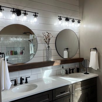 VR Custom Homes - a bathroom with two sinks and mirrors - General Contractors Near Me