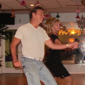 Suncoast Ballroom - a man and a woman dancing - Dance Clubs Near Me - Largo, Florida Suncoast Ballroom - a man and a woman dancing - Dance Clubs Near Me - Largo, Florida