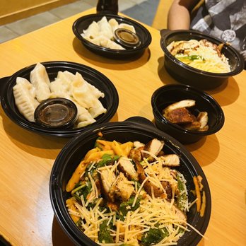 Noodles and Company - a man sitting at a table with plates of food - Noodles Near Me - Richmond, Virginia Noodles and Company - a man sitting at a table with plates of food - Noodles Near Me - Richmond, Virginia