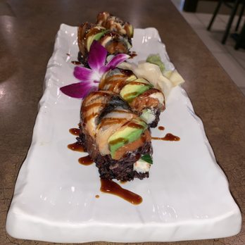 O'Sushi Canton - Imperial Roll with Black Rice garnished with a Flower.  Beautiful presentation. - Japanese Near Me - Canton, Michigan