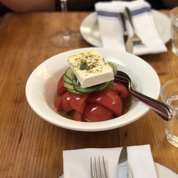 Mamakas Taverna - Horiatiki - tomato, cucumber, feta salad drenched in olive oil and olive tapenade $19 - Greek Near Me - Toronto, Ontario