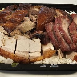 Fat Boy BBQ - Three treasure rice rice with crispy roast pork, barebque pork, and duck - $13