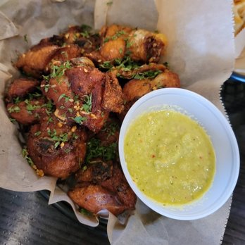 Valeu Espetos - a basket of chicken wings and a bowl of dipping sauce - Brazilian Near Me - Montrose, California