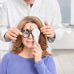 Specialty Eye Institute - Woman getting her eyes tested at the eye doctors. office