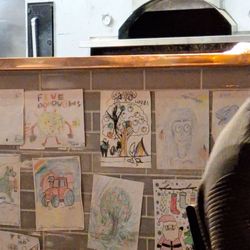 Five Boroughs Pizza Tavern - Someone's special drawing hung all over the kitchen wall.