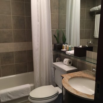 Library Hotel by Library Hotel Collection - The bathroom in the Romance Room on the Language Floor. - Hotels Near Me - New York, New York Library Hotel by Library Hotel Collection - The bathroom in the Romance Room on the Language Floor. - Hotels Near Me - New York, New York