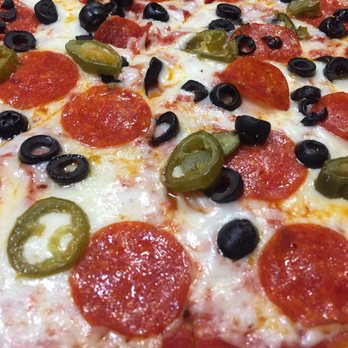 Niki's Pizza - Pepperoni, black olive, and jalapeño gluten free pizza. - Italian Near Me - Round Rock, Texas