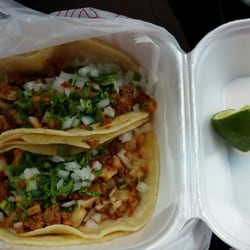 Primo's Tacos - Two corn tortilla tacos with chorizo and papas and queso!