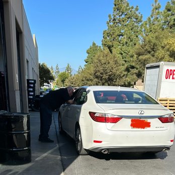 Big O Tires - Steve Nabor, store manager, consulting with mechanic - Tires Near Me - Irvine, California Big O Tires - Steve Nabor, store manager, consulting with mechanic - Tires Near Me - Irvine, California