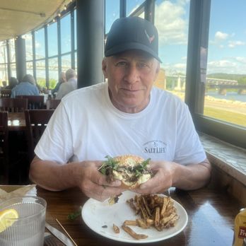 The Boat House - My husband, eating a hamburger Riverside - New American Near Me - Winona, Minnesota The Boat House - My husband, eating a hamburger Riverside - New American Near Me - Winona, Minnesota