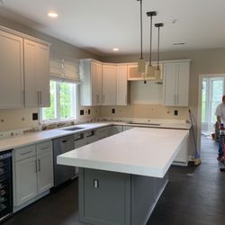 Wholesale Granite Marble & Tile - Arctic white quartz standard edge perimeter with apron front Island