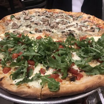Five Points Pizza - Top 1/2 Spinach Gorgonzola and bottom 1/2 Rocket Pie - Italian Near Me - Nashville, Tennessee Five Points Pizza - Top 1/2 Spinach Gorgonzola and bottom 1/2 Rocket Pie - Italian Near Me - Nashville, Tennessee