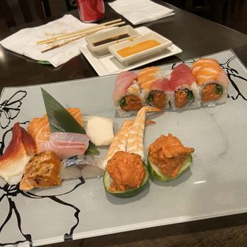 Sushi Palace - Assorted sashimi and Kamikaze Roll - A plate of assorted sushi and sashimi, including rolls, nigiri, and garnishes, served on a decorative square dish. - Sushi Bars Near Me - Summit, New Jersey