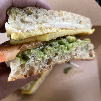 Ulew Coffee & Juice - Breakfast sando eggs, pesto, avocado, cheese, turkey, tomato and pickled jalapeños. Focaccia, sourdough or baguette. - Coffee & Tea Near Me - Los Angeles, California Ulew Coffee & Juice - Breakfast sando eggs, pesto, avocado, cheese, turkey, tomato and pickled jalapeños. Focaccia, sourdough or baguette. - Coffee & Tea Near Me - Los Angeles, California