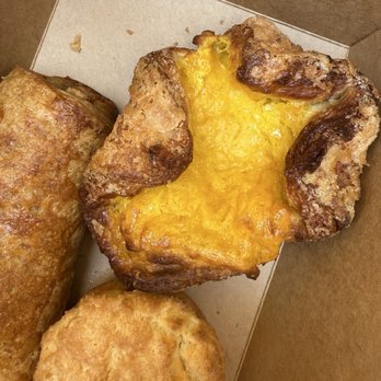 Rolling Out Cafe - Mango sticky rice kouign amann, mochi biscuit, and a sausage roll - Bakeries Near Me - San Diego, California
