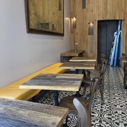 a row of tables in a restaurant a row of tables in a restaurant
