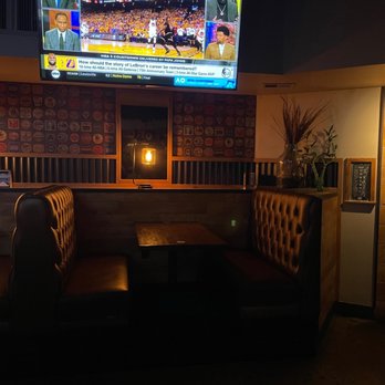 The Thirsty Merchant - Inside booth and TV - New American Near Me - Valley Village, California The Thirsty Merchant - Inside booth and TV - New American Near Me - Valley Village, California