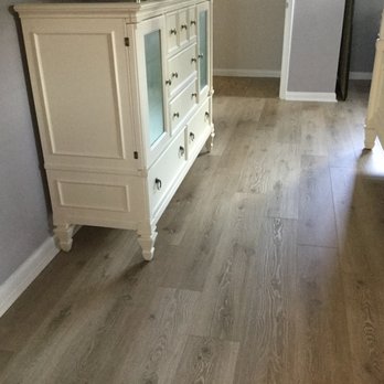 Dolphin Carpet & Tile - a hardwood floor in a bedroom - Flooring Near Me - Miami, Florida