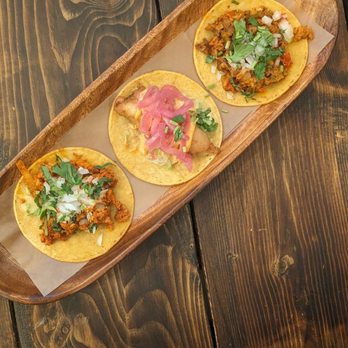 Ay Caramba, Eh - three tacos on a wooden tray - Mexican Near Me - Vaughan, Ontario