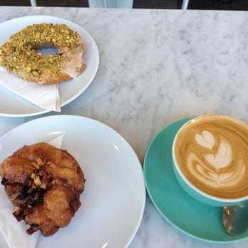 49th Parallel Coffee - Orange pistachio old fashioned and bacon apple fritter.. And a dirty chai - Coffee & Tea Near Me - Vancouver, British Columbia 49th Parallel Coffee - Orange pistachio old fashioned and bacon apple fritter.. And a dirty chai - Coffee & Tea Near Me - Vancouver, British Columbia