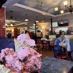 Homer's Ice Cream - Raspberry Chocolate Chip in a waffle cone
