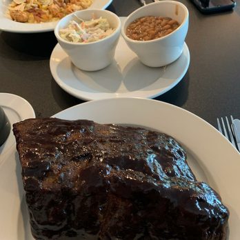 Eating Americana - 1/2 rack of big Baby Back Ribs. Beans, Slaw and Loaded Mac n Cheese with Chicken Bites and Bacon. - New American Near Me - Norcross, Georgia