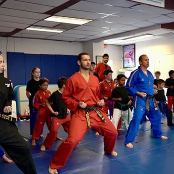 Master Sang's TNT - Aventura - Instructors showing class proper form for Martial Arts. - Kickboxing Near Me - Aventura, Florida Master Sang's TNT - Aventura - Instructors showing class proper form for Martial Arts. - Kickboxing Near Me - Aventura, Florida