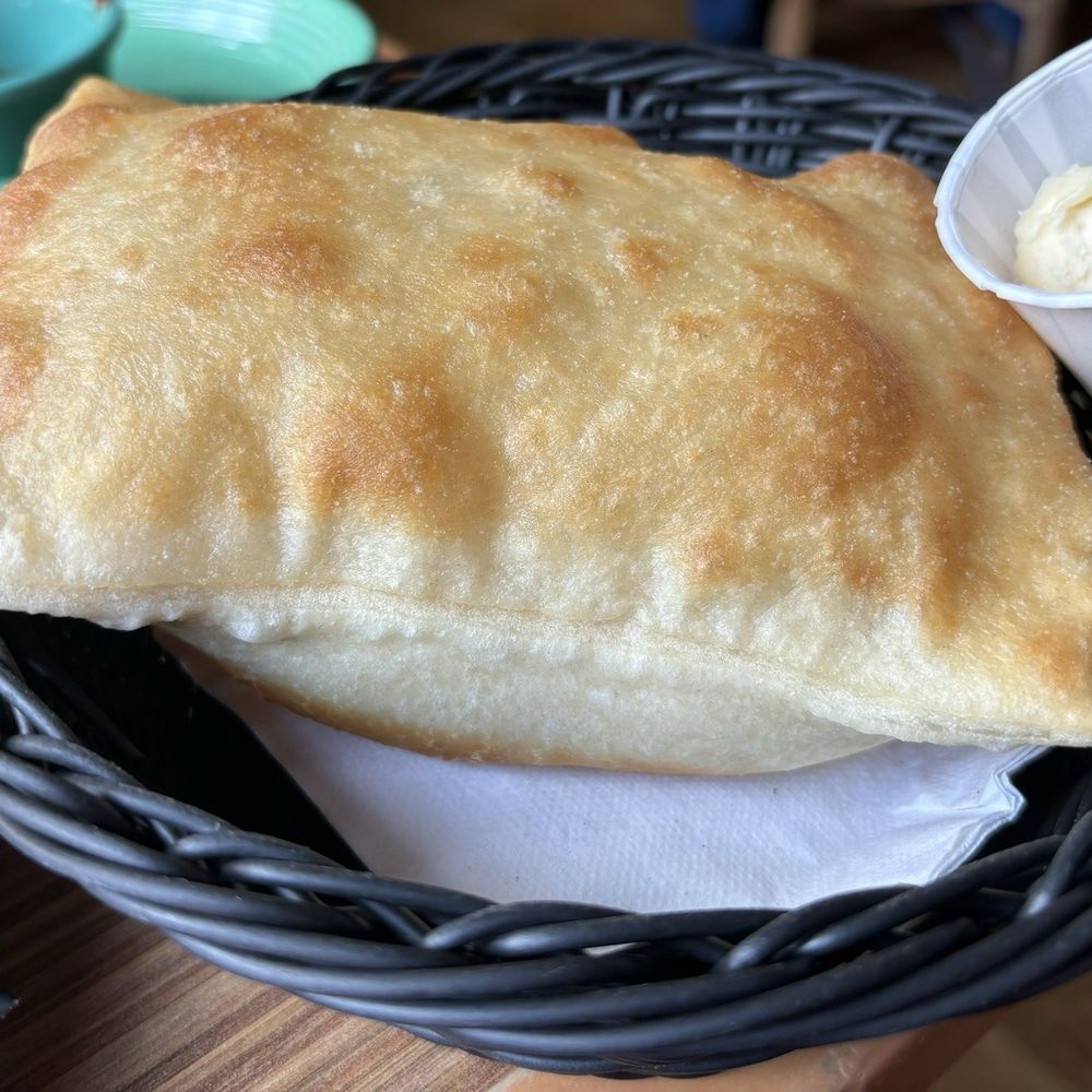 Tomasita's - Amazing Sopaipilla with butter and honey. - New Mexican Cuisine Near Me - Santa Fe, New Mexico Tomasita's - Amazing Sopaipilla with butter and honey. - New Mexican Cuisine Near Me - Santa Fe, New Mexico