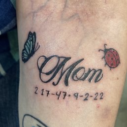 Mom with a ladybug & butterfly & my mom's birthday and death date.