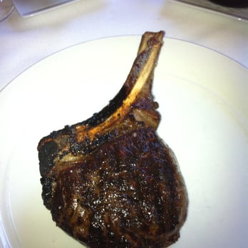 Roots Steakhouse - This is the cowboy rib steak, missing anything? Its not a pork chop roots, you removed the only part a patron would order this! - Steakhouses Near Me - Summit, New Jersey Roots Steakhouse - This is the cowboy rib steak, missing anything? Its not a pork chop roots, you removed the only part a patron would order this! - Steakhouses Near Me - Summit, New Jersey