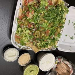 Chicken and steak nachos, churros Chicken and steak nachos, churros