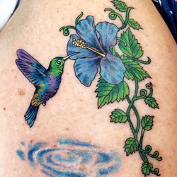North Atlantic Tattoo - Hummingbird tattoo on outer arm.