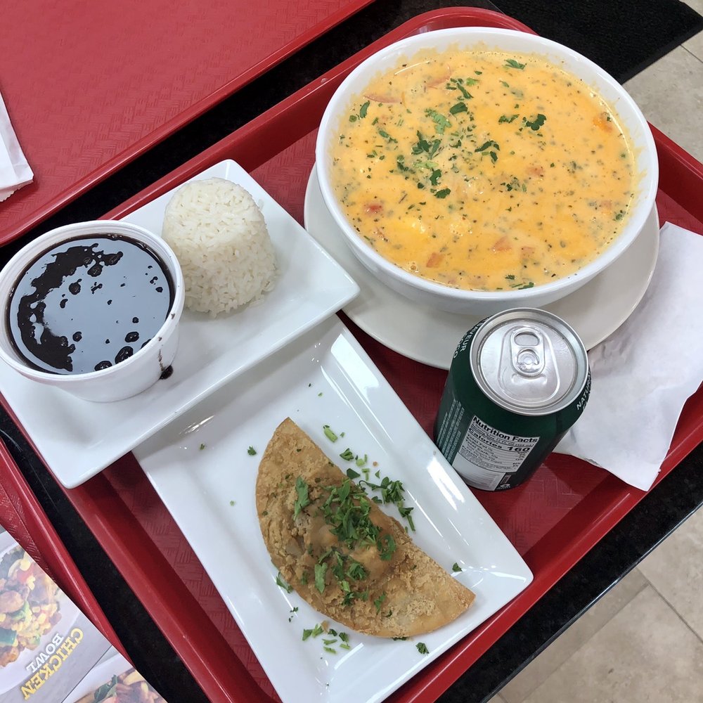 Seafood gumbo; beef empanada; white rice & black beans. Seafood gumbo; beef empanada; white rice & black beans.