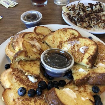Six Chicks Scratch Kitchen - French toast made with challah bread. Side of hash browns. - New American Near Me - South Haven, Michigan Six Chicks Scratch Kitchen - French toast made with challah bread. Side of hash browns. - New American Near Me - South Haven, Michigan