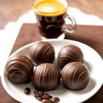 Rocky Mountain Chocolate - a plate of chocolate truffles and a cup of coffee - Chocolatiers & Shops Near Me - Folsom, California Rocky Mountain Chocolate - a plate of chocolate truffles and a cup of coffee - Chocolatiers & Shops Near Me - Folsom, California