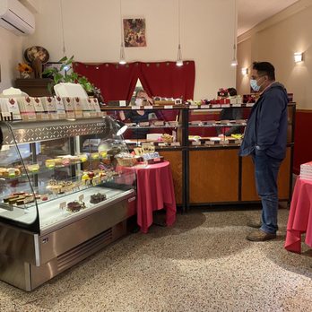 Chocolaterie Bonneau - a man standing in a bakery - Creperies Near Me - Montreal, Quebec Chocolaterie Bonneau - a man standing in a bakery - Creperies Near Me - Montreal, Quebec