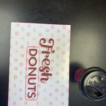 Donut Mart - a box of donuts and a cup of coffee - Donuts Near Me - Albuquerque, New Mexico