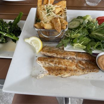 Next Door Beach Bistro - Red snapper, fries, salad, and broccolini - Seafood Near Me - Flagler Beach, Florida Next Door Beach Bistro - Red snapper, fries, salad, and broccolini - Seafood Near Me - Flagler Beach, Florida
